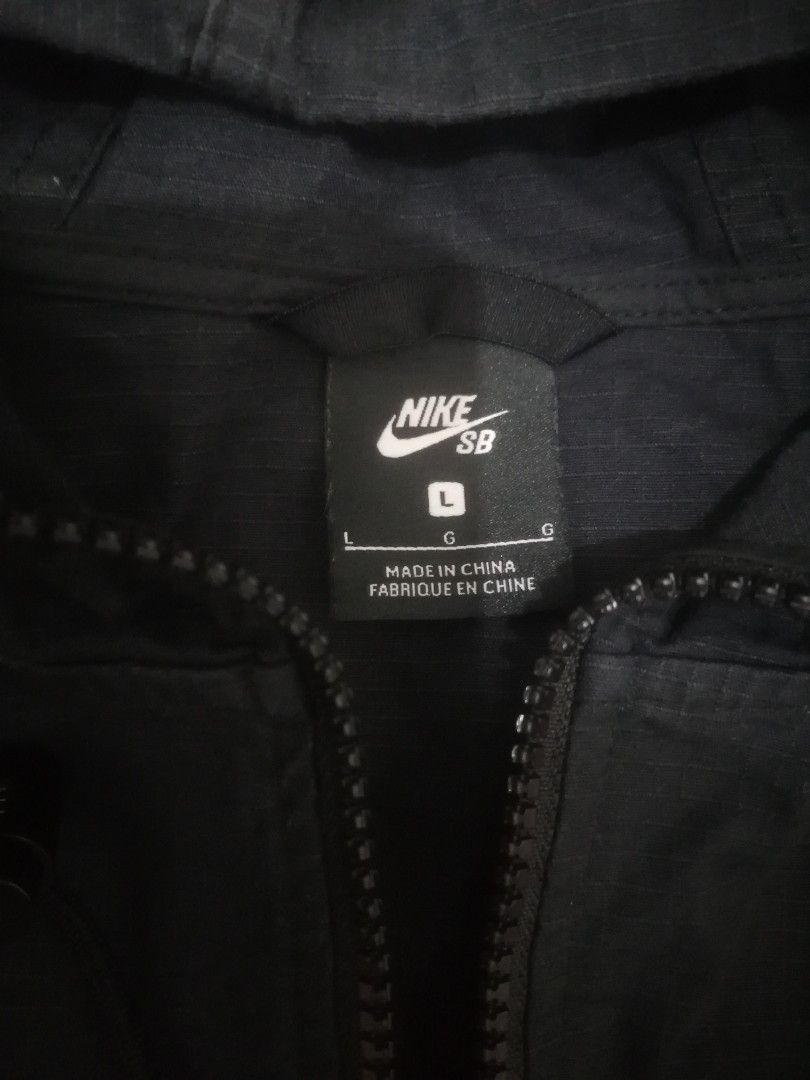 Nike SB Black Anorak Hoodie Jacket (Category: Coats, Jackets and Outerwear) located in Cebu City. Submitted by roadthrift (Listing ID 1470135299, Image 3). Description: - Brand: Nike SB - Item: Anorak Jacket with Hood - Color: Black with white chest logo - Size: L (fits height 170-180 cm) - Material: 97% cotton, 3% spandex - Features: Half-zip front, front kangaroo pocket, adjustable hood drawstrings - Condition: Clean and well-maintained.