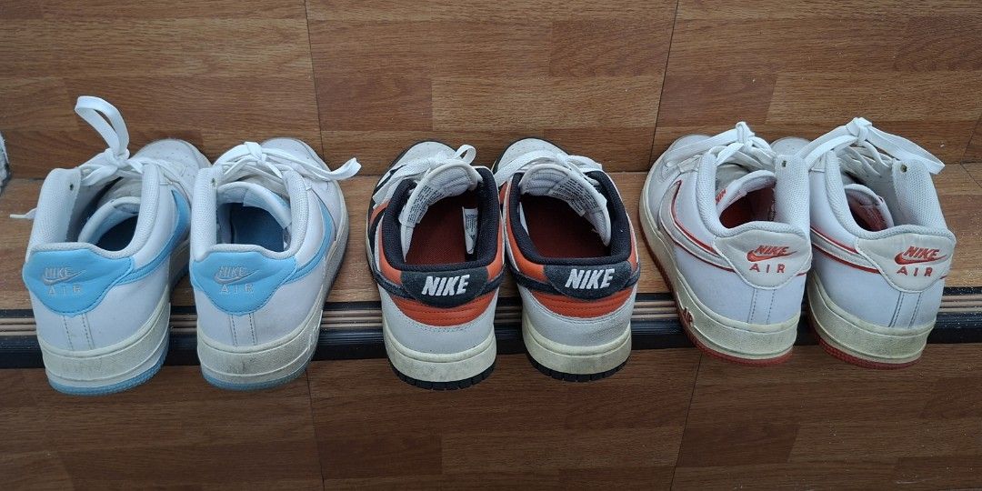 Nike Sneakers Bundle - Air Force 1 & Dunk (Category: Sneakers) located in Las Pinas. Submitted by _niksss (Listing ID 1469953608, Image 2). Description: - Bundle includes 3 pairs of Nike sneakers - Colorways: Light Blue/White AF1s, Orange/Black Dunks, Orange/White AF1s - Condition: A little dirty since hindi na nagagamit, lightly yellowing in midsoles, and No sole seps. Very good condition overall - Selling all three pairs together as a bundle se