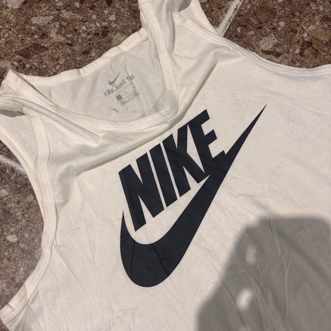 Nike Tank Tops (Category: Activewear) located in Manila. Submitted by loydgani (Listing ID 1470035572, Image 3). Description: Size: (L) Length: 30 Width: 22 Issue: need wash The color may vary due to lightning. 400 + sf 📦Jnt 📍Cebu .