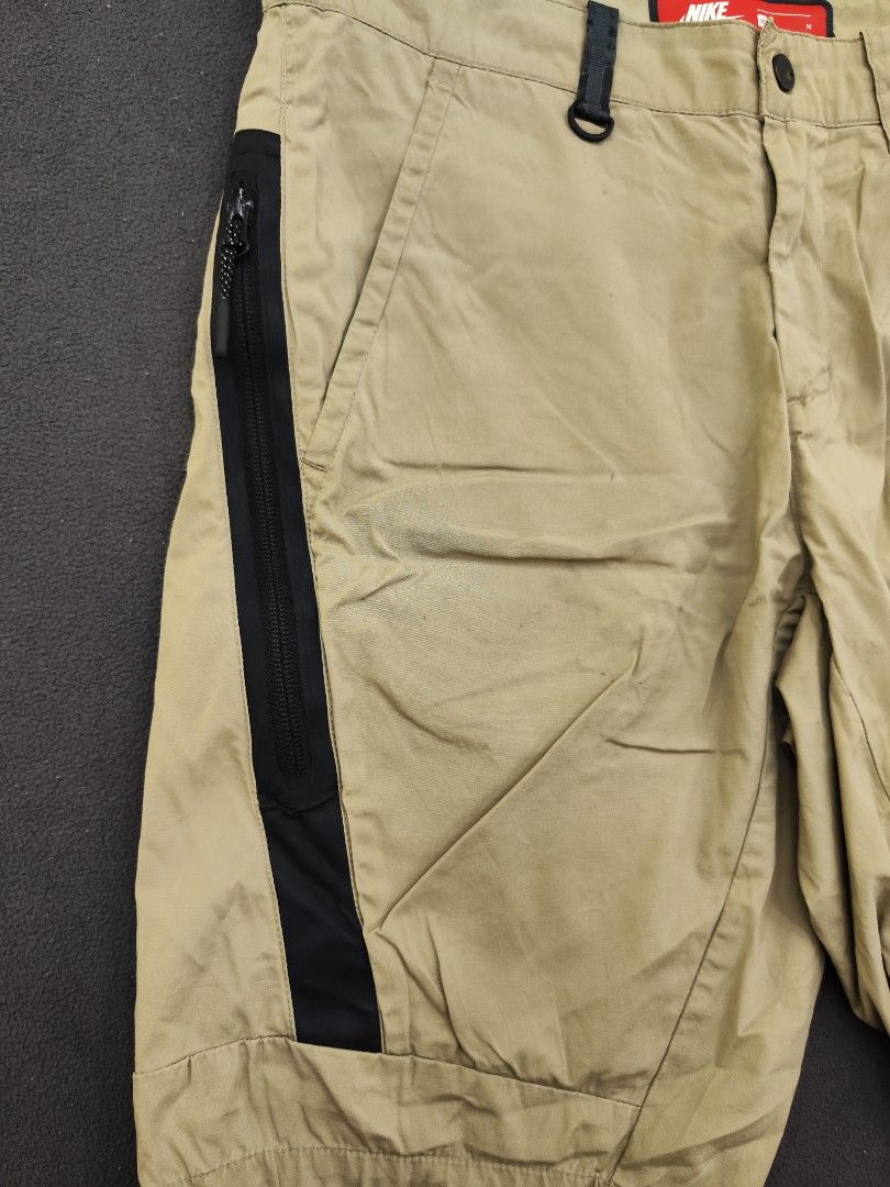 Nike Tech Nylon Beige Shorts (Category: Shorts) located in Bulacan. Submitted by emilj23 (Listing ID 1469966138, Image 3). Description: Nike Tech Nylon Beige Shorts Size M on tag L 20 W 32 Leg Hole 9 Condition 9/10 Color rate 9.5/10 Issue Minimal Stains Pinholes.