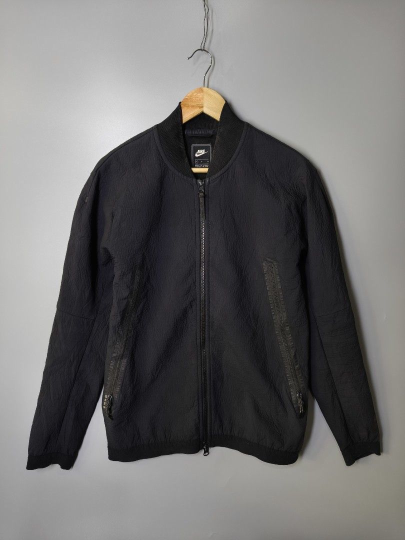 Nike Tech Pack Bomber (Category: Coats, Jackets and Outerwear) located in Baguio. Submitted by modern6tone6 (Listing ID 1470029436, Image 1). Description: Excellent Condition 9.5/10 color rate Medium on tag 21 Width 27 Length.