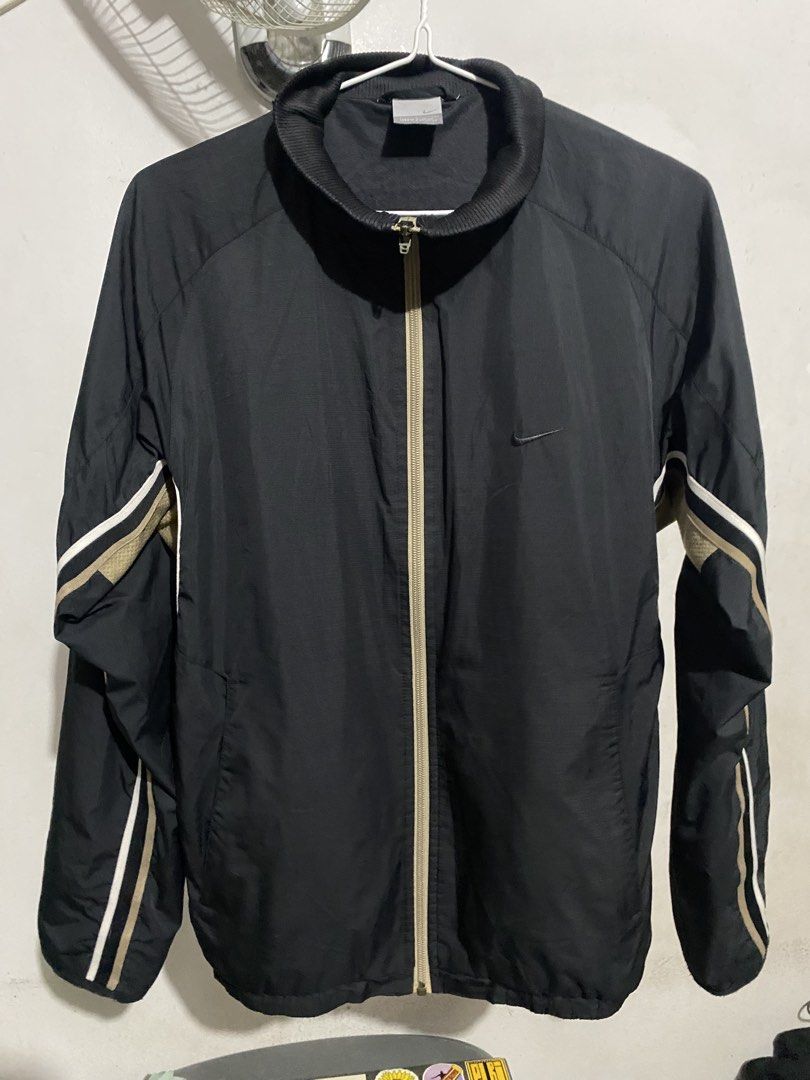 Nike Vintage Black Nylon Track Jacket Size S (Category: Coats, Jackets and Outerwear) located in Angono. Submitted by ronangelo12 (Listing ID 1470111955, Image 1). Description: 00s Nike Y2K Nylon Jacket with Embroidered Swoosh Logo, Black & Gold Size - Small Kindly see last pic for issue Price - 1200 (nego) Loc - Binangonan Rizal / Pasig City MOP - Gcash, Maribank, BOC MOD - Lalamove or meet up.