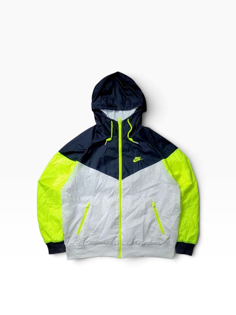 NIKE WINDRUNNER HOODED JACKET (Category: Hoodies) located in Manila. Submitted by 7100treasure.co (Listing ID 1470046769, Image 1). Description: NIKE WINDRUNNER HOODED JACKET ⚡ vibrant neon colorblock design! • Model: Windrunner Track Jacket • Colorway: Navy Blue, Neon Volt Yellow, and Off-White / Grey (Tri-color chevron colorblock) • Measurements: 24" Width x 26" Length • 📍 Location: Mindanao 🚚 Shipping: J&T Express Nationwide 💳 Payment: GCas
