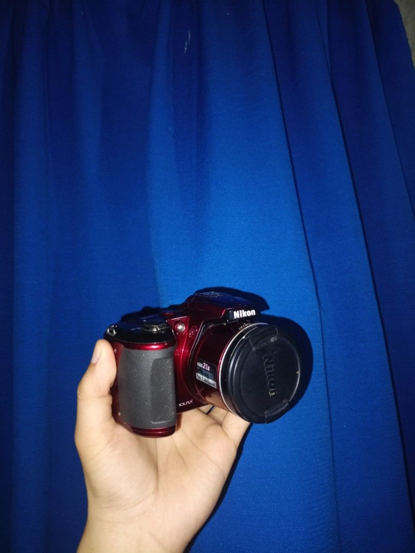 Nikon Coolpix L120 Red Digital Camera (Category: Cameras) located in Marikina City. Submitted by kenken1219 (Listing ID 1470049374, Image 3). Description: - Model: Red Nikon Coolpix L120 Digital Camera - Lens: Powerful 21x wide optical zoom lens + original Nikon lens cap included - Power: Uses convenient, easy-to-find standard AA batteries - Design: Comfortable right-side hand grip and user-friendly rear control layout - Extras: Features a clear 