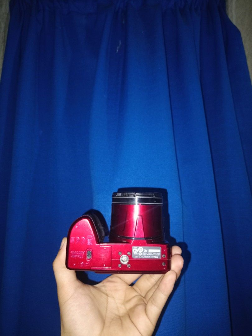 Nikon Coolpix L120 Red Digital Camera (Category: Cameras) located in Marikina City. Submitted by kenken1219 (Listing ID 1470049374, Image 2). Description: - Model: Red Nikon Coolpix L120 Digital Camera - Lens: Powerful 21x wide optical zoom lens + original Nikon lens cap included - Power: Uses convenient, easy-to-find standard AA batteries - Design: Comfortable right-side hand grip and user-friendly rear control layout - Extras: Features a clear 