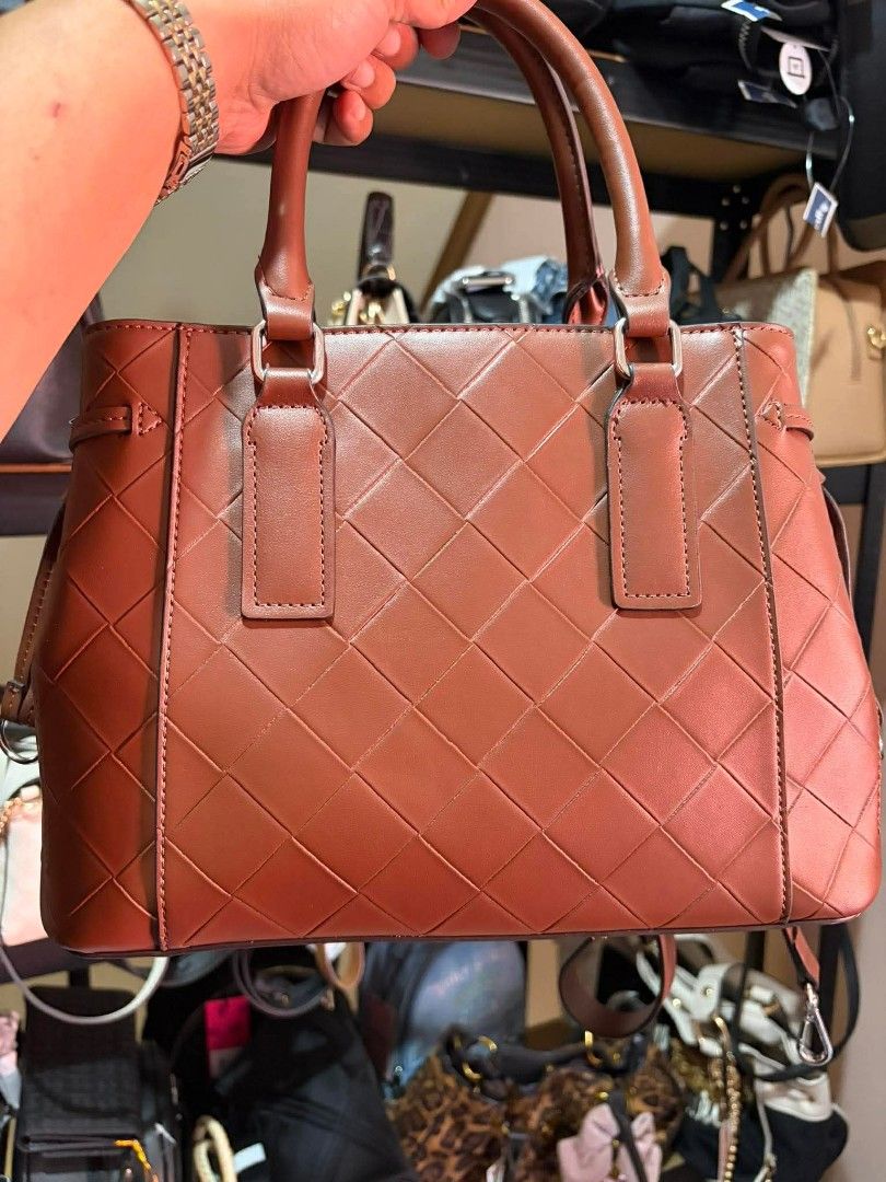 Nine West Mahogany Quilted Handbag with Strap (Category: Luxury Bags & Wallets) located in Manila. Submitted by belovedbyjess (Listing ID 1469978749, Image 3). Description: - Brand: Nine West (Original Macy's Backstage tag still attached) - Color & Material: Mahogany brown faux leather with quilted diamond pattern - Hardware: Silver-tone metal - Closure: Top zip closure - Straps: Two top handles plus a detachable, adjustable shoulder strap - Inte