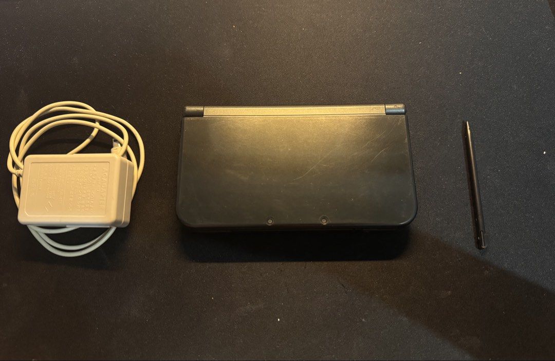 Nintendo New 3DS XL (IPS Top Screen) – Fully Working (Category: Nintendo) located in Manila. Submitted by charliefort (Listing ID 1469978015, Image 2). Description: Includes: - Nintendo New 3DS XL Console - IPS Top Screen - 16GB microSD Card (installed) - Original Charger - Protective Shell Case - Carrying Case / Pouch - Aftermarket Stylus (included, does not fit in the console's stylus slot) Condition: - Fully functional - Touchscreen working - 