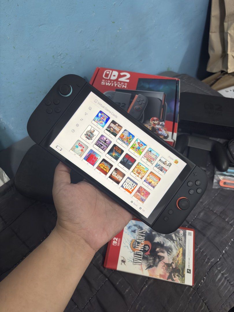 Nintendo Switch 2 with Games (Category: Nintendo) located in Cavite. Submitted by xsavier88 (Listing ID 1470120712, Image 2). Description: 🌟Nintendo Switch 2 with Games Open for trade sa Nintendo Switch OLED/V2/V1/LIte or PS4/PS5 add ka cash. 29,500 PHP 29,500 PHP 29,500 PHP 🌟INCLUSIONS: Box, TV dock, Grip, Straps, HDMI & Charging Cable Large Carrying Pouch Wild Hearts S Mario Kart World (Digital Copy. Already installed) 3 Primary Access Games 