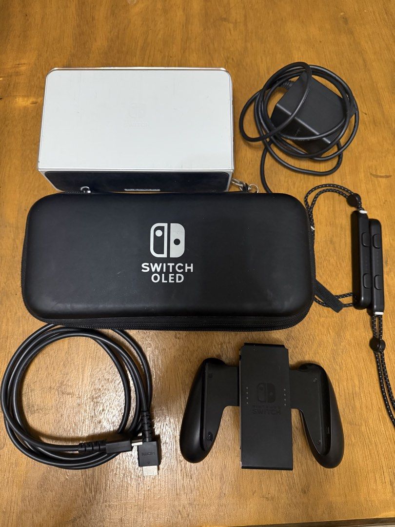 Nintendo Switch OLED Model White with SD Card and complete accessories (Category: Nintendo) located in Valenzuela. Submitted by wornandwandered (Listing ID 1470088302, Image 1). Description: - Nintendo Switch OLED Console (White) with cute case - Includes original power adapter, HDMI cable, joy-con controllers, straps, and grip - Comes with black carrying case - Fully tested and 100% working smoothly - with SD card 128gb - no games included - wit