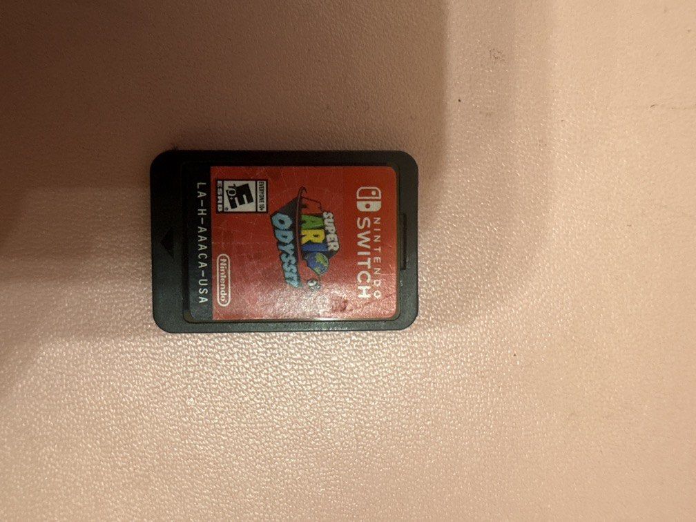 Nintendo Switch Super Mario Odyssey Catridge (Category: Nintendo) located in Imus. Submitted by mooonke (Listing ID 1470132803, Image 1). Description: doesn't come with a case! there is a error message that pops up when you insert but it still works rfs: needing funds.