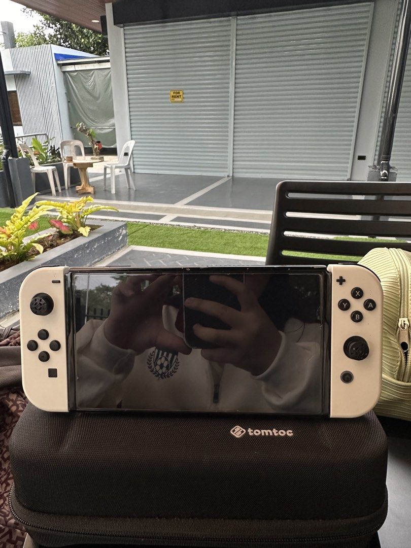 Nintendo Switch V1 Console Bundle + 3 Games + Accessories (Category: Nintendo) located in Roxas City. Submitted by tel_02 (Listing ID 1470045220, Image 1). Description: INCLUSIONS • Nintendo Switch console with white Joy-Cons • The Legend of Zelda: Breath of the Wild • The Legend of Zelda: Tears of the Kingdom • Pokémon Legends: Arceus • Joy-Con grip • 2 Joy-Con wrist straps • Charger/AC adapter • tomtoc carrying case CONDITION • Used, with signs