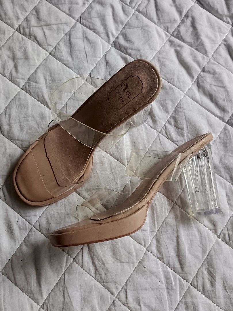 Nude Clear Strap Chunky Heels Size 36 (Category: Heels) located in Cebu City. Submitted by vionchan (Listing ID 1469978452, Image 1). Description: - Brand: Clou (Made in China) - Size: 36 (stamped on sole) - Style: Nude heels with clear PVC double straps and open square toe - Heel: Thick transparent block heel - Condition: Gentle wear on soles; minor peeling near the insole stamping area (check photos).