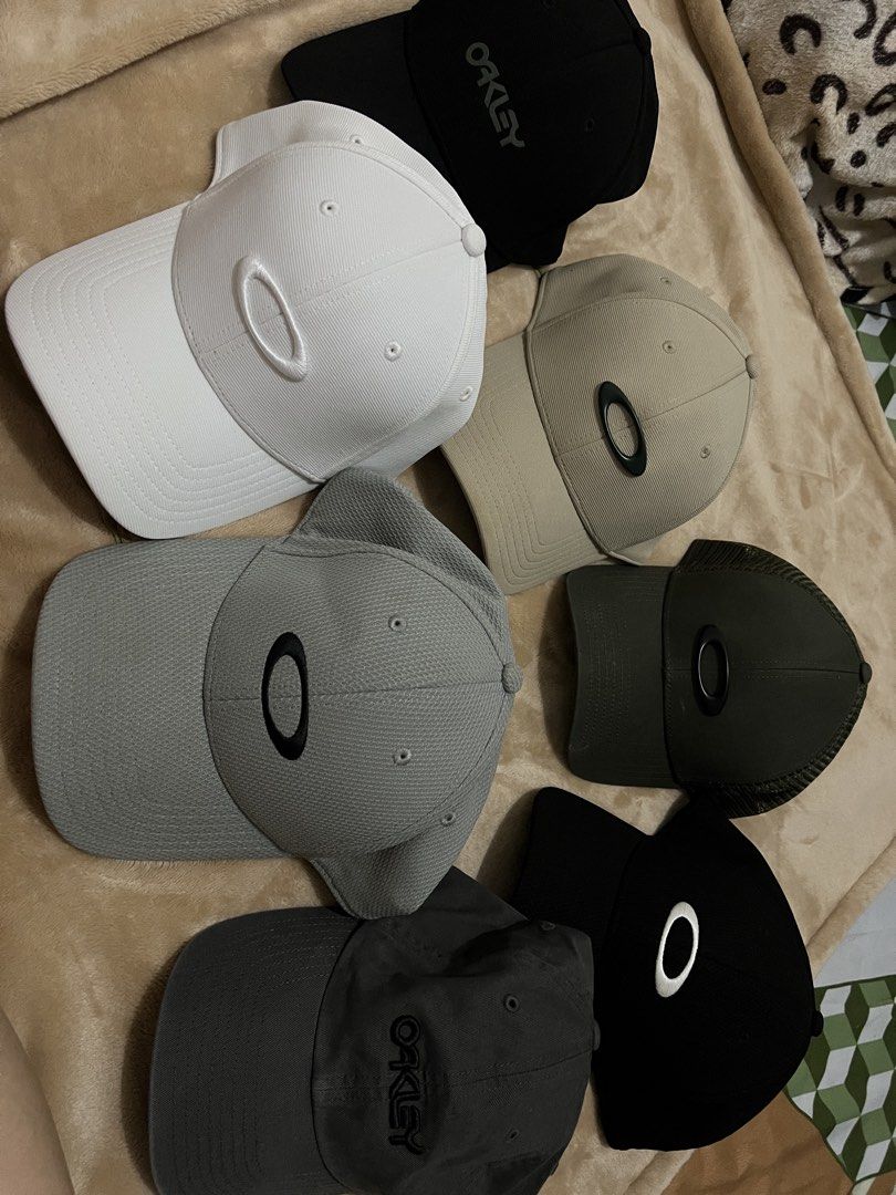 Oakley Baseball Cap Hat Collection Multiple Colors Available (Category: Caps & Hats) located in Binan City. Submitted by thetidyqueen (Listing ID 1470076692, Image 2). Description: - Brand: Oakley - Available Colors: White, Black, Grey, Dark Grey, Khaki, and Olive Green - Design: Iconic oval logo on the front; select styles feature script logo embroidery - Fit: Structured panels with a curved brim and adjustable back strap - Condition: Brand new 