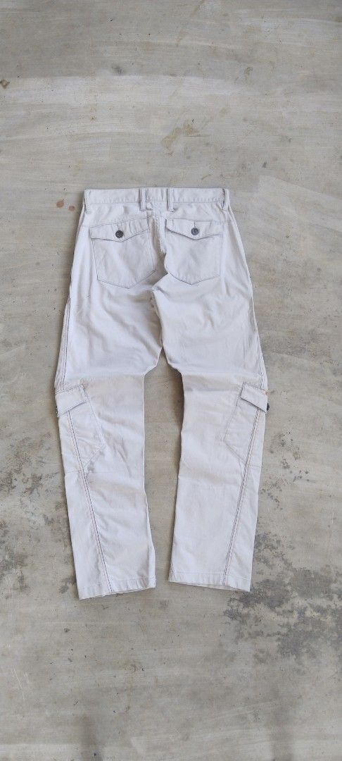 Oakley Cargo Pants Cream Size 30 (Category: Jeans) located in Manila. Submitted by 27moby (Listing ID 1470005912, Image 1). Description: - Brand/Model: Oakley Cargo Pants - Color: Cream - Size: Waist 30 - Material: Cotton-poly blend with stretch - Fit: Straight leg with front panel seam details - Pockets: Multiple utility pockets with button closures and back welt pockets with flap covers - Details: Distinctive orange Oakley embroidery on the rig
