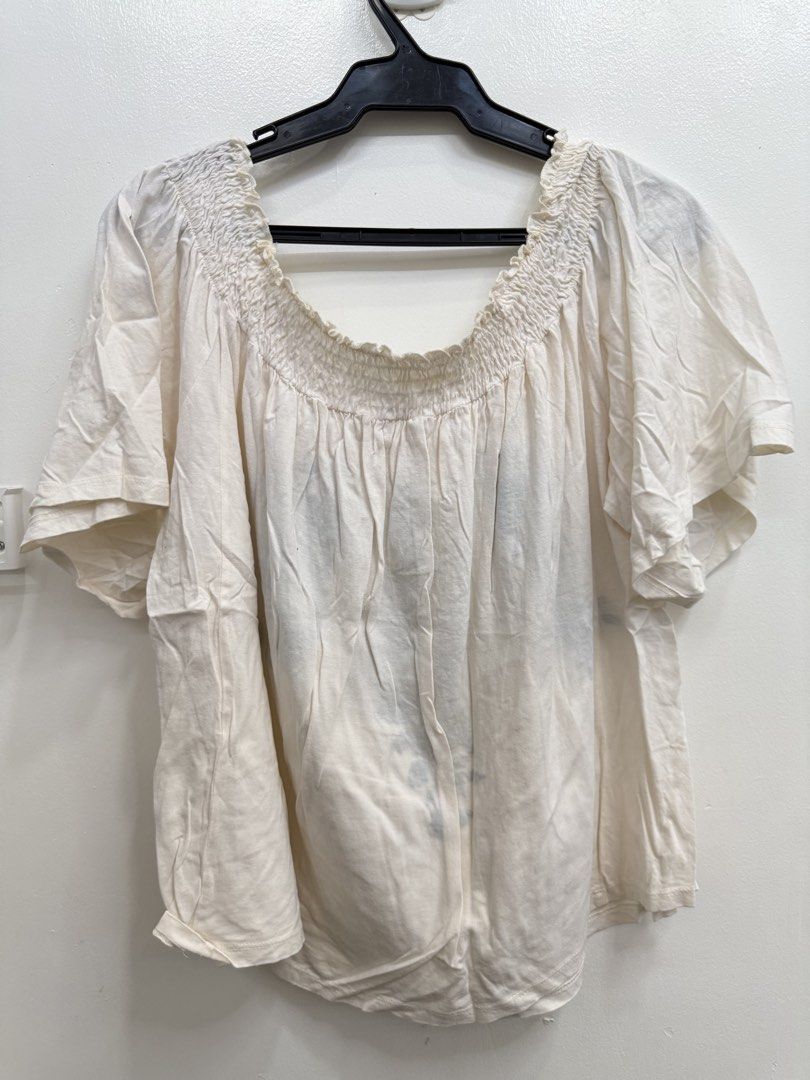 Off-shoulder white floral embroidered blouse (Category: Blouses) located in Quezon City. Submitted by reivia.vend (Listing ID 1469987114, Image 3). Description: - Style: Off-shoulder top with smocked neckline - Design: Dark green floral embroidery down front and sides - Details: Short sleeves, lightweight fabric - Size: EUR 38.