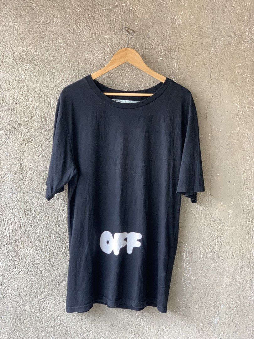 Off-White Black Graphic Tee (Category: Tshirts & Polo Shirts ) located in Manila. Submitted by goldenstone.1f7250 (Listing ID 1469953076, Image 1). Description: - Brand: Off-White - Color: Black - Fit: Relaxed fit with classic crew neckline - Material: Standard cotton -Excellent condition -Color rate 9/10 -Dimes 20X30 -Authentic .