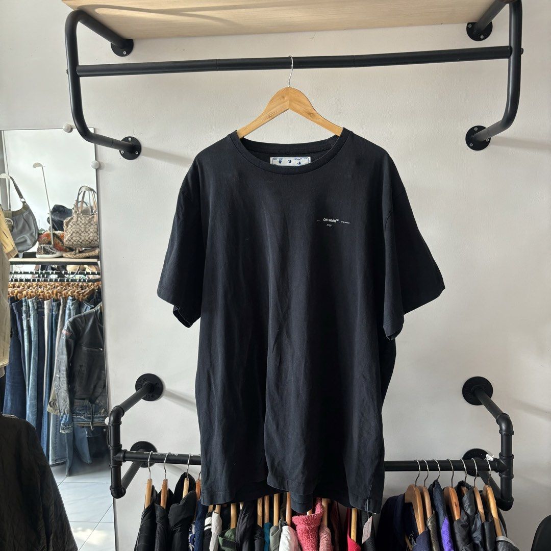Off-White Black T-Shirt Size L (Category: Shirts) located in Bambang. Submitted by heats777 (Listing ID 1470020444, Image 2). Description: - Authentic Off-White black t-shirt - Size: Large (True to size) - Material: 100% comfortable cotton - Design: Minimalist front print branding with classic crew neck and short sleeves - Condition: Good.