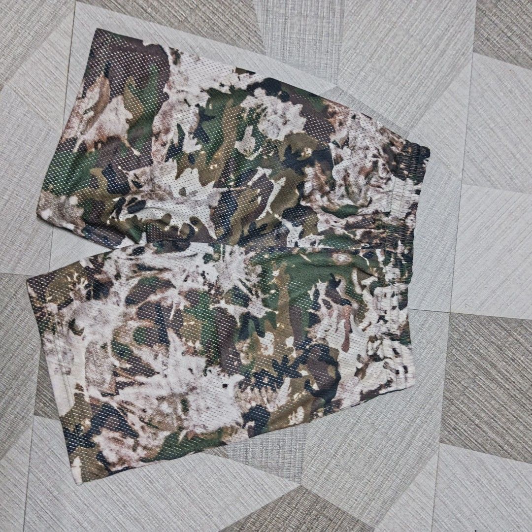 Off-White Camo Mesh Shorts (Category: Shorts) located in Manila. Submitted by charleshustla (Listing ID 1470110166, Image 3). Description: - Brand: Off-White - Design: Camo mesh shorts with signature black diagonal side stripes and white logo text near the hem - Material: Lightweight and breathable mesh fabric throughout - Fit: Comfortable elastic waistband with a black adjustable drawstring - Ideal for streetwear and casual summer fits.