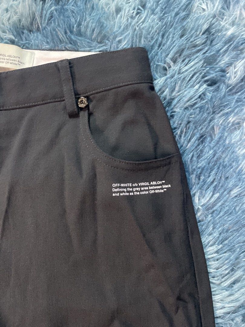 Off-White c/o Virgil Abloh Black Trousers (Category: Trousers) located in Manila. Submitted by jssur (Listing ID 1470084326, Image 2). Description: - Brand: Off-White - Color: Black - Fit: Straight leg - Details: Signature Virgil Abloh branding near the pocket, engraved waist buttons, back patch pockets - Condition: Excellent, no damage noted.