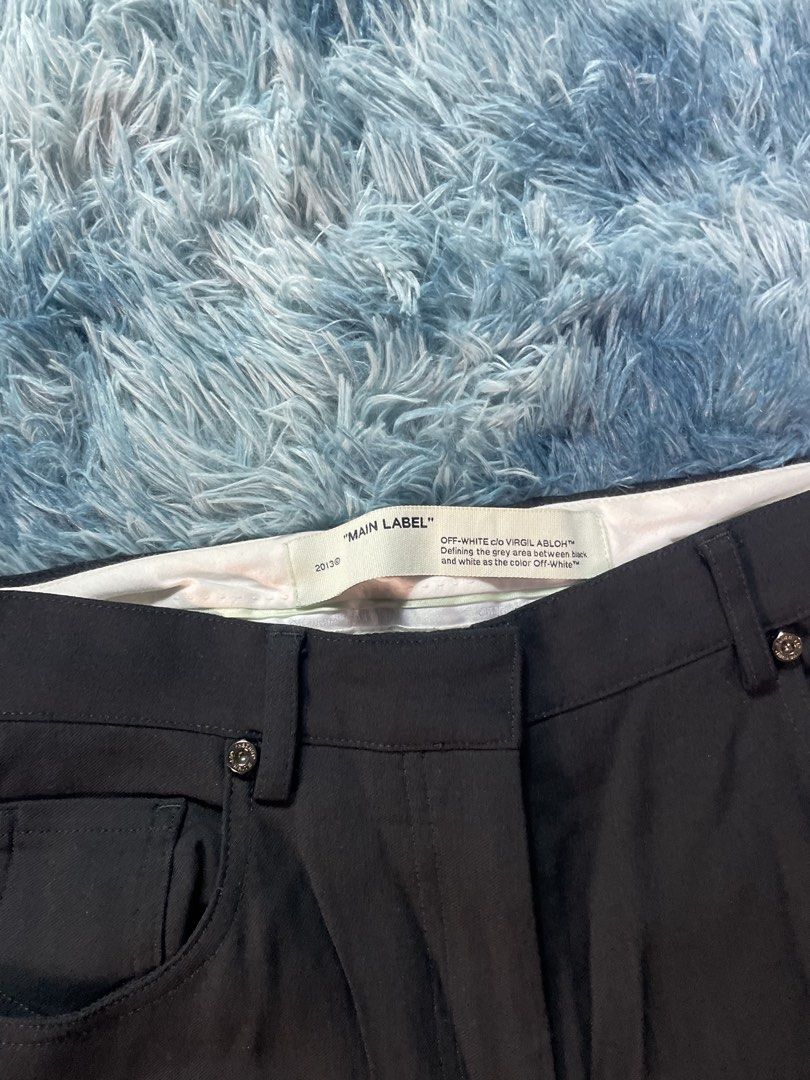 Off-White c/o Virgil Abloh Black Trousers (Category: Trousers) located in Manila. Submitted by jssur (Listing ID 1470084326, Image 3). Description: - Brand: Off-White - Color: Black - Fit: Straight leg - Details: Signature Virgil Abloh branding near the pocket, engraved waist buttons, back patch pockets - Condition: Excellent, no damage noted.