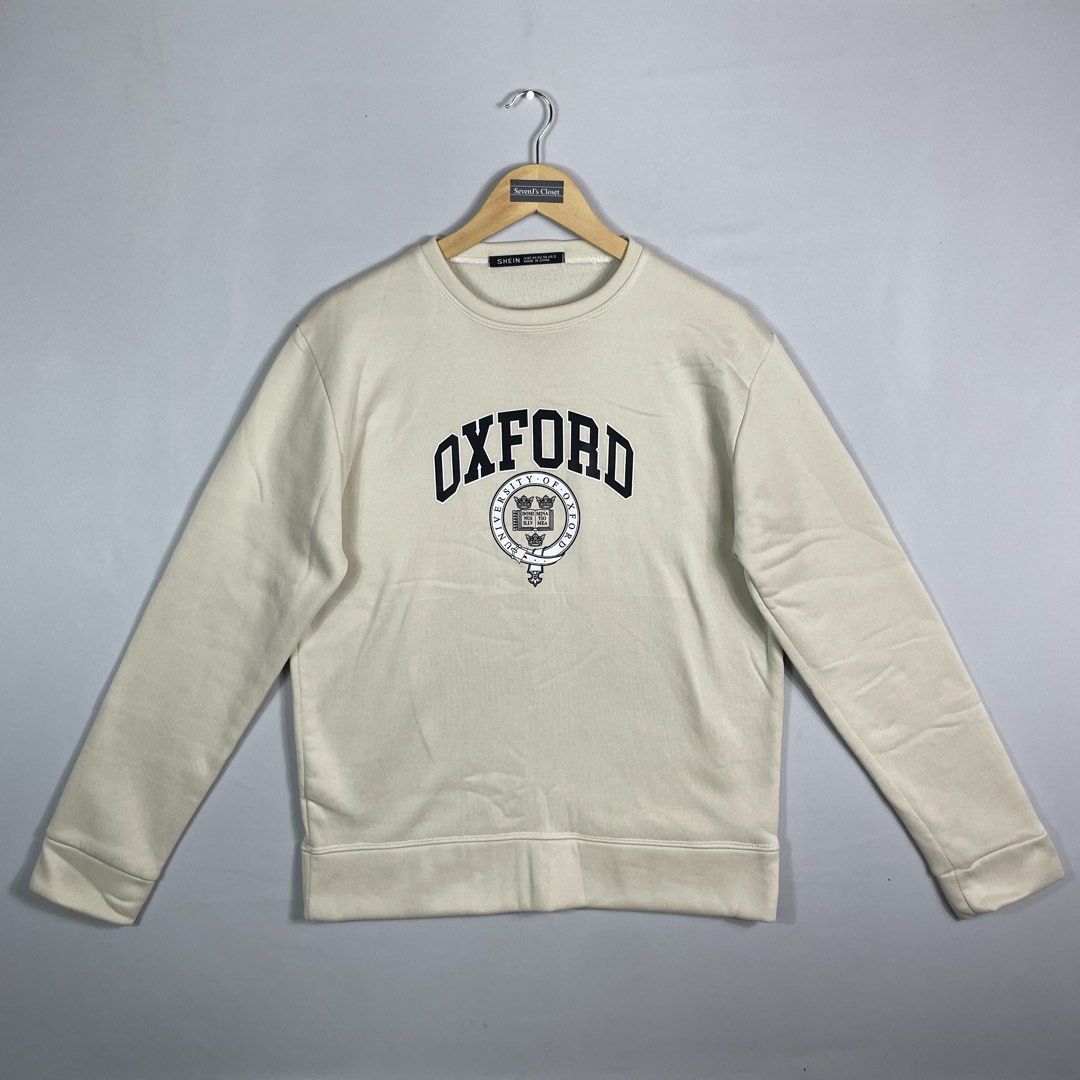 Off-White OXFORD Sweatshirt Unisex (Category: Coats, Jackets and Outerwear) located in Norzagaray. Submitted by sevenjscloset (Listing ID 1470017615, Image 1). Description: - Brand/Style: Off-White Oxford sweatshirt in neutral off-white cream - Size: Tagged XS, but relaxed fit fits like a Medium to Large - Measurements: 27 inches length, 21 inches width - Details: Collegiate chest print, classic crewneck style, ribbed cuffs and hem - Condition/Us