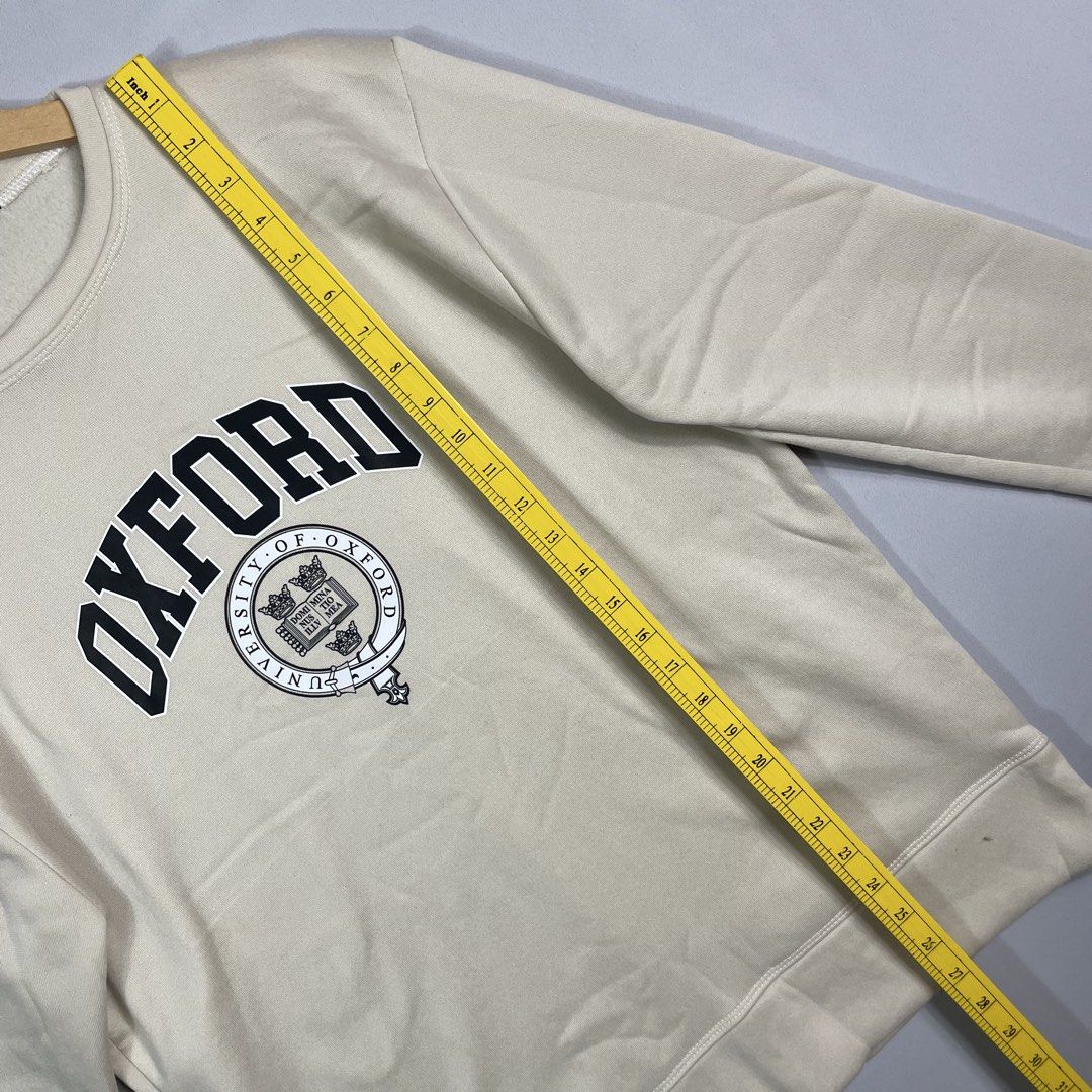 Off-White OXFORD Sweatshirt Unisex (Category: Coats, Jackets and Outerwear) located in Norzagaray. Submitted by sevenjscloset (Listing ID 1470017615, Image 3). Description: - Brand/Style: Off-White Oxford sweatshirt in neutral off-white cream - Size: Tagged XS, but relaxed fit fits like a Medium to Large - Measurements: 27 inches length, 21 inches width - Details: Collegiate chest print, classic crewneck style, ribbed cuffs and hem - Condition/Us