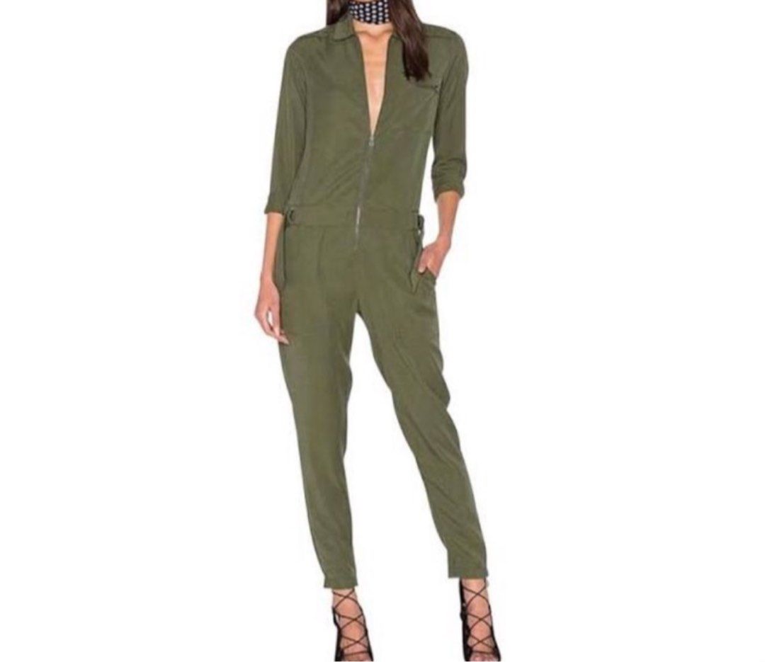Olive Green Utility Jumpsuit with Front Zip No Belt (Category: Jumpsuits) located in Manila. Submitted by lovenewseason (Listing ID 1470060715, Image 1). Description: - Color: Khaki green (See actual pics) NO BELT, Never Worn - Style: Utility jumpsuit with front zipper and pointed collar - Details: Features convenient side pockets and long sleeves - Fabric: Lightweight and comfortable for all-day wear - Versatility: Easy to dress up with heels or