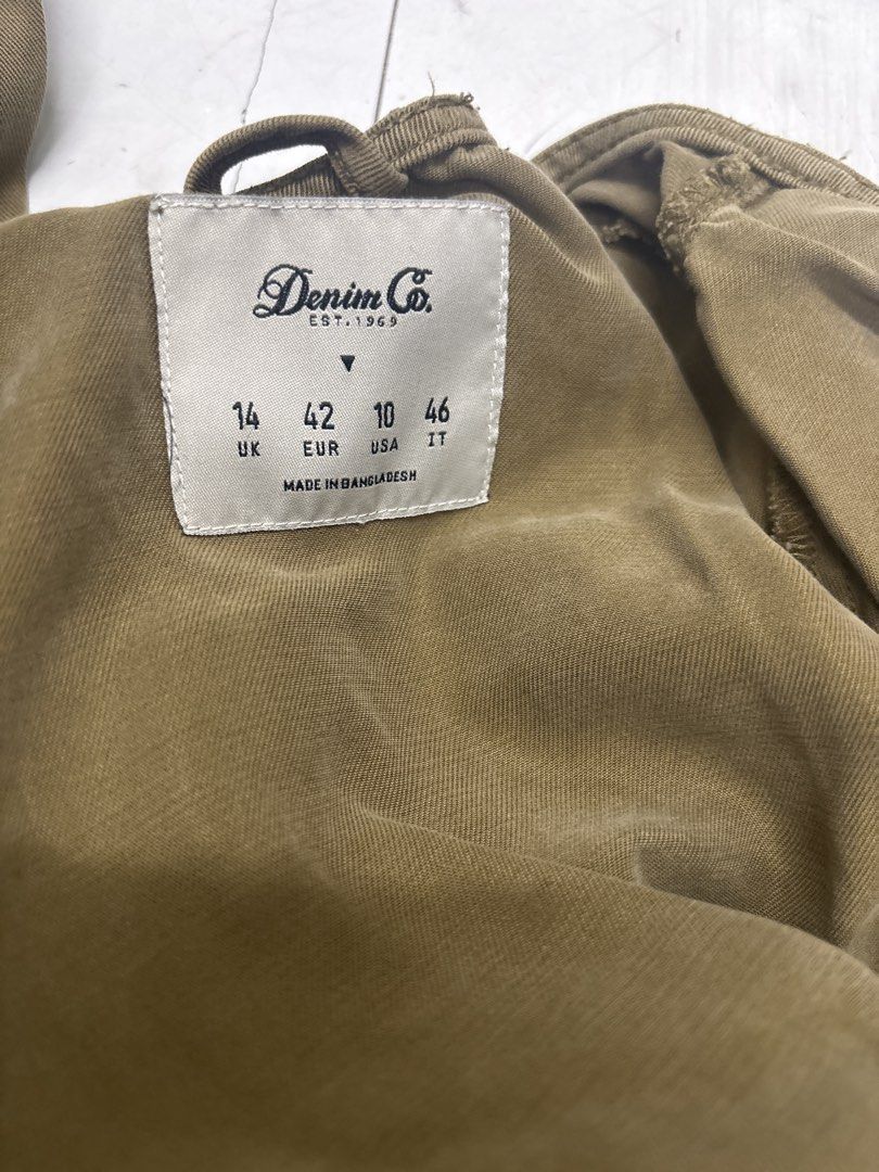 Olive Green Utility Jumpsuit with Front Zip No Belt (Category: Jumpsuits) located in Manila. Submitted by lovenewseason (Listing ID 1470060715, Image 2). Description: - Color: Khaki green (See actual pics) NO BELT, Never Worn - Style: Utility jumpsuit with front zipper and pointed collar - Details: Features convenient side pockets and long sleeves - Fabric: Lightweight and comfortable for all-day wear - Versatility: Easy to dress up with heels or