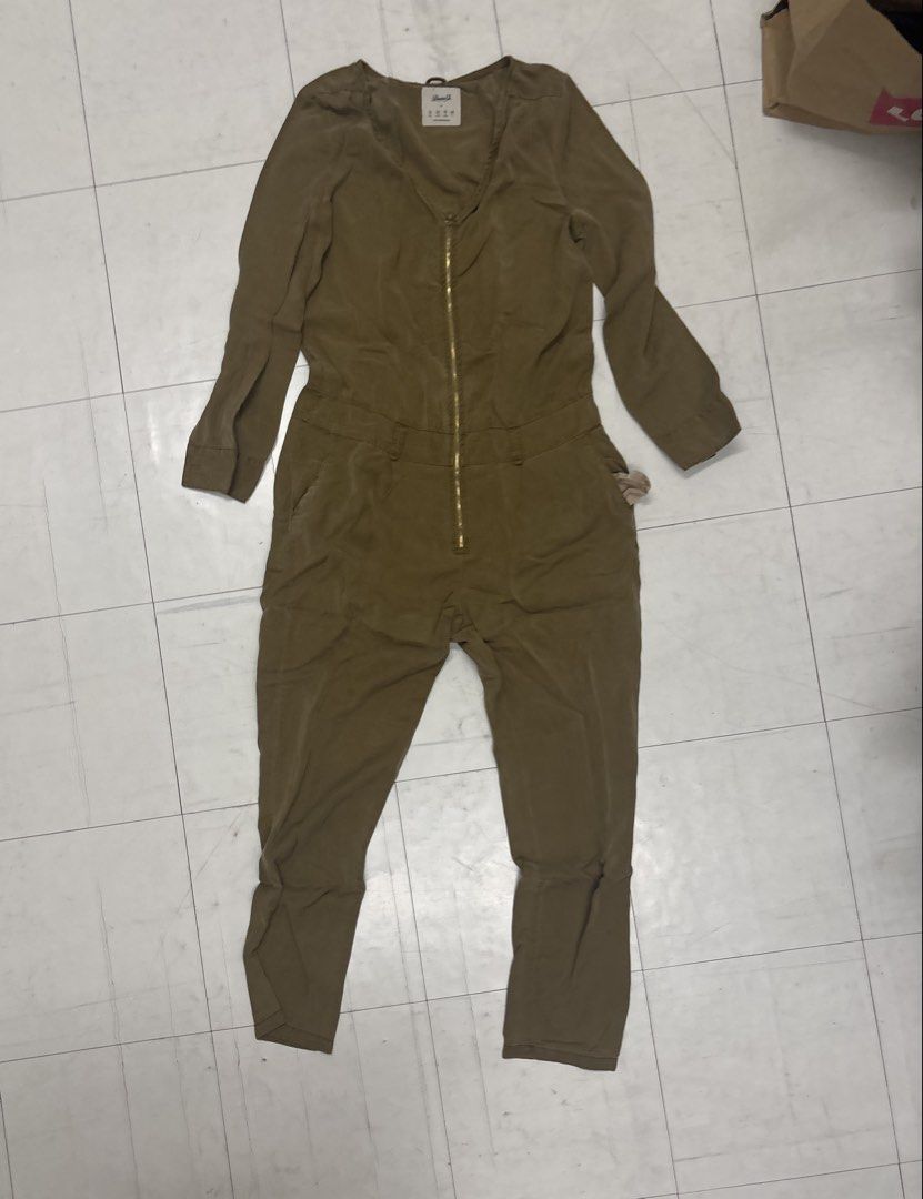 Olive Green Utility Jumpsuit with Front Zip No Belt (Category: Jumpsuits) located in Manila. Submitted by lovenewseason (Listing ID 1470060715, Image 3). Description: - Color: Khaki green (See actual pics) NO BELT, Never Worn - Style: Utility jumpsuit with front zipper and pointed collar - Details: Features convenient side pockets and long sleeves - Fabric: Lightweight and comfortable for all-day wear - Versatility: Easy to dress up with heels or