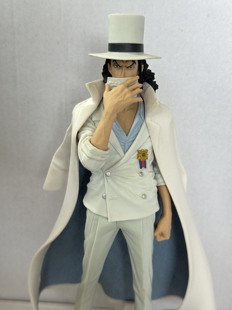 One Piece Rob Lucci Figure CP9 (Category: Figurines & Statues) located in President Roxas. Submitted by isserminator (Listing ID 1469956020, Image 2). Description: - Character: Rob Lucci (CP9 Arc, One Piece) - Design: White suit, top hat, coat on shoulders, hand covering lower face - Inclusions: Includes base stand for display - Condition: Good display piece - Perfect for: Anime fans and figure collectors.