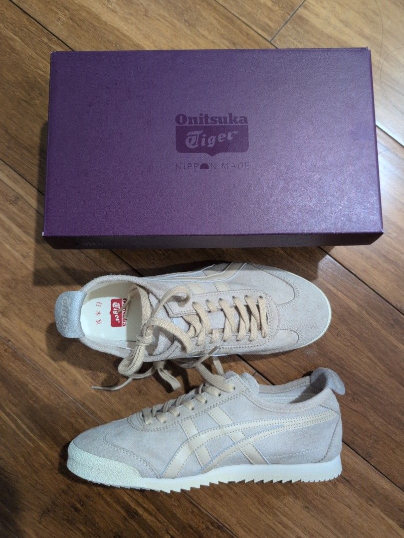 Onitsuka Tiger Mexico 66 Deluxe Nippon made (Category: Sneakers) located in Manila. Submitted by csisters3 (Listing ID 1469965610, Image 1). Description: - Brand: Onitsuka Tiger - Color: Beige cream - Material: Premium suede upper with ridged rubber sole - Style: Classic low-top casual sneakers with signature side stripes - Features: Cushioned insoles with red logo branding - Inclusions: Original purple box and matching laces - Condition: newly b