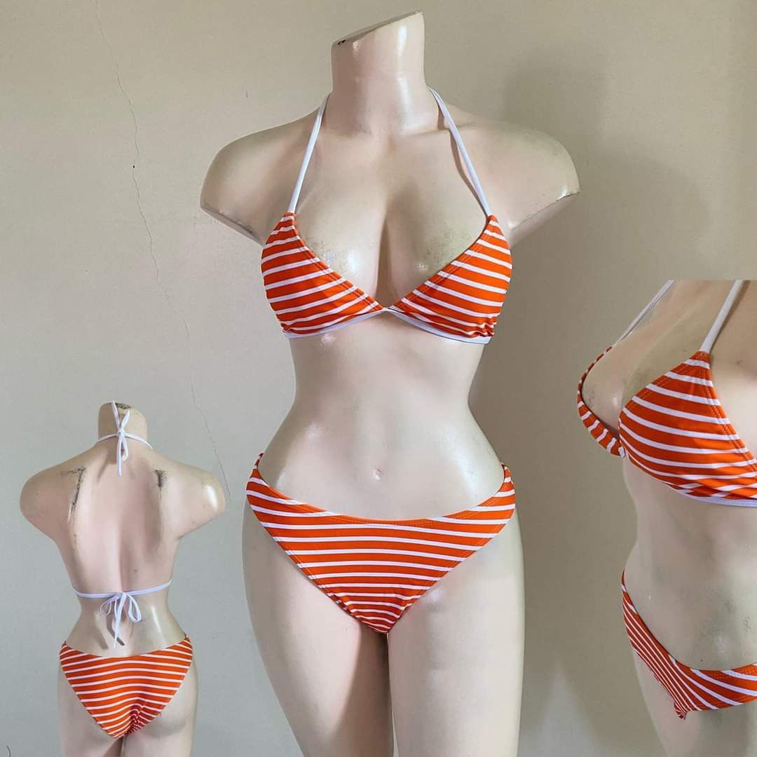 Orange and White Striped Bikini Set (Category: Bikinis & Swimsuits) located in Bacoor. Submitted by Miss_Chuch0521 (Listing ID 1470053087, Image 2). Description: - Style: Two-piece bikini with orange and white stripes - Top: Triangle halter with adjustable neck and back ties - Bottoms: Matching low-rise design - Perfect for: Beach trips, pool parties, and vacations.