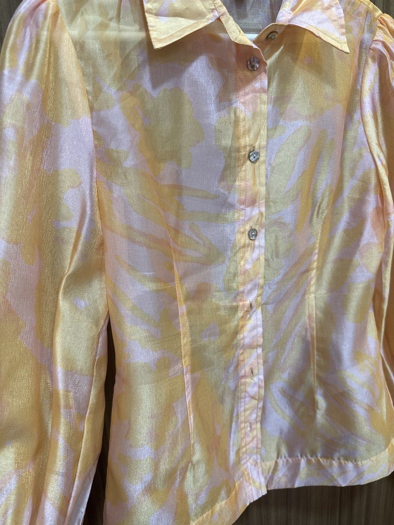 Orange Pink Abstract Print Puff Sleeve Blouse (Category: Blouses) located in Quezon City. Submitted by dropdeadprices (Listing ID 1470009176, Image 3). Description: - Brand: Urban Revivo - Size: EUR 36 - Design: Yellow and pink abstract pattern - Details: Long sleeves, gathered puff shoulders, button cuffs, classic pointed collar - Fabric: Lightweight with a slight sheen. Piña-like almost filipiñana - Condition: Clean, no stains or flaws Just was