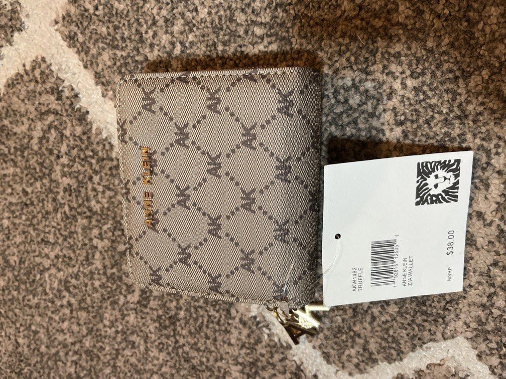 Original anne klein wallet from U.S (Category: Wallets & Card holders) located in Manila. Submitted by ty_imported_goods (Listing ID 1470031236, Image 1). Description: ❗️on sale ❗️ Issue: see picture (missing 1 button).