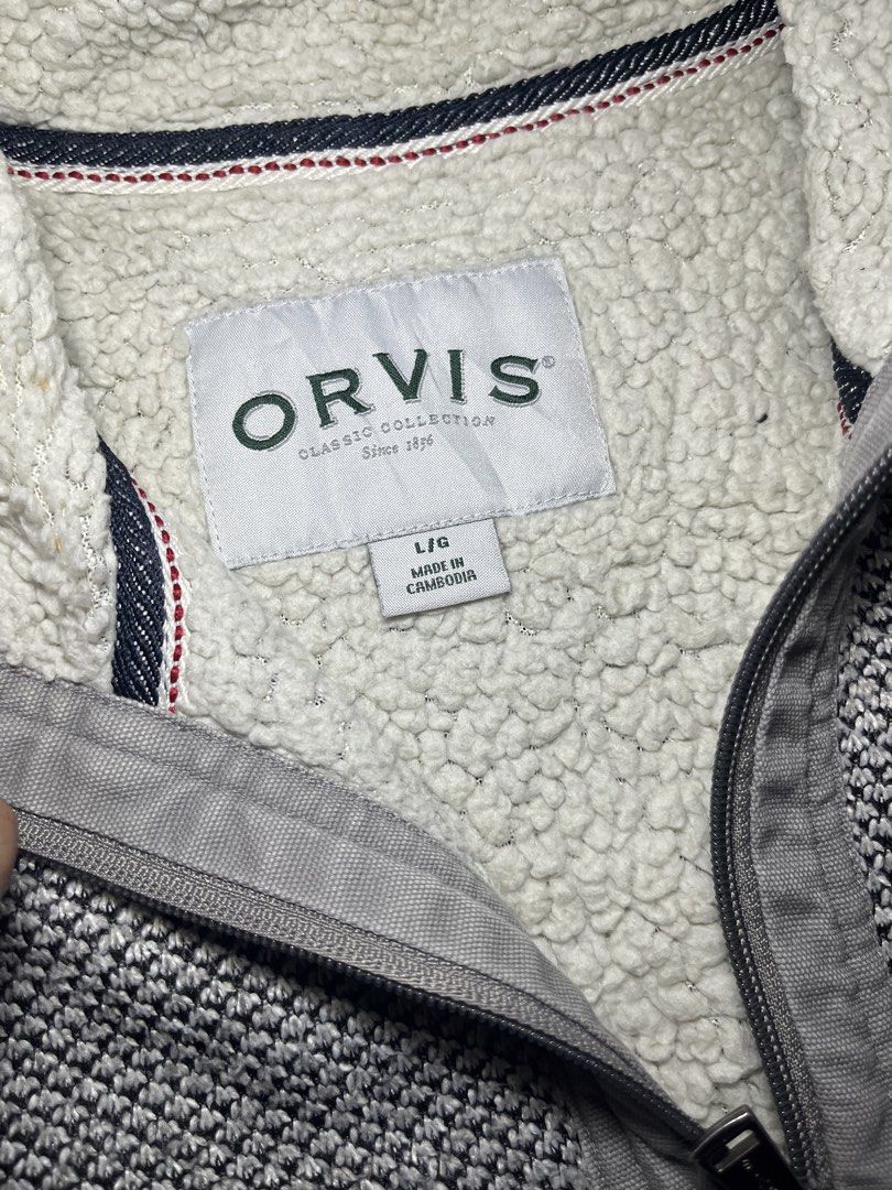 Orvis Classic Collection Grey Quarter-Zip Sherpa Lined Pullover (Category: Coats, Jackets and Outerwear) located in Muntinlupa City. Submitted by pastforwardthrift (Listing ID 1470124178, Image 3). Description: - Brand: Orvis Classic Collection - Style: Quarter-zip pullover in grey and white textured knit - Interior: Warm sherpa fleece lining on the body and inside the collar - Details: Branded zipper pull and subtle leather logo patch on the lef