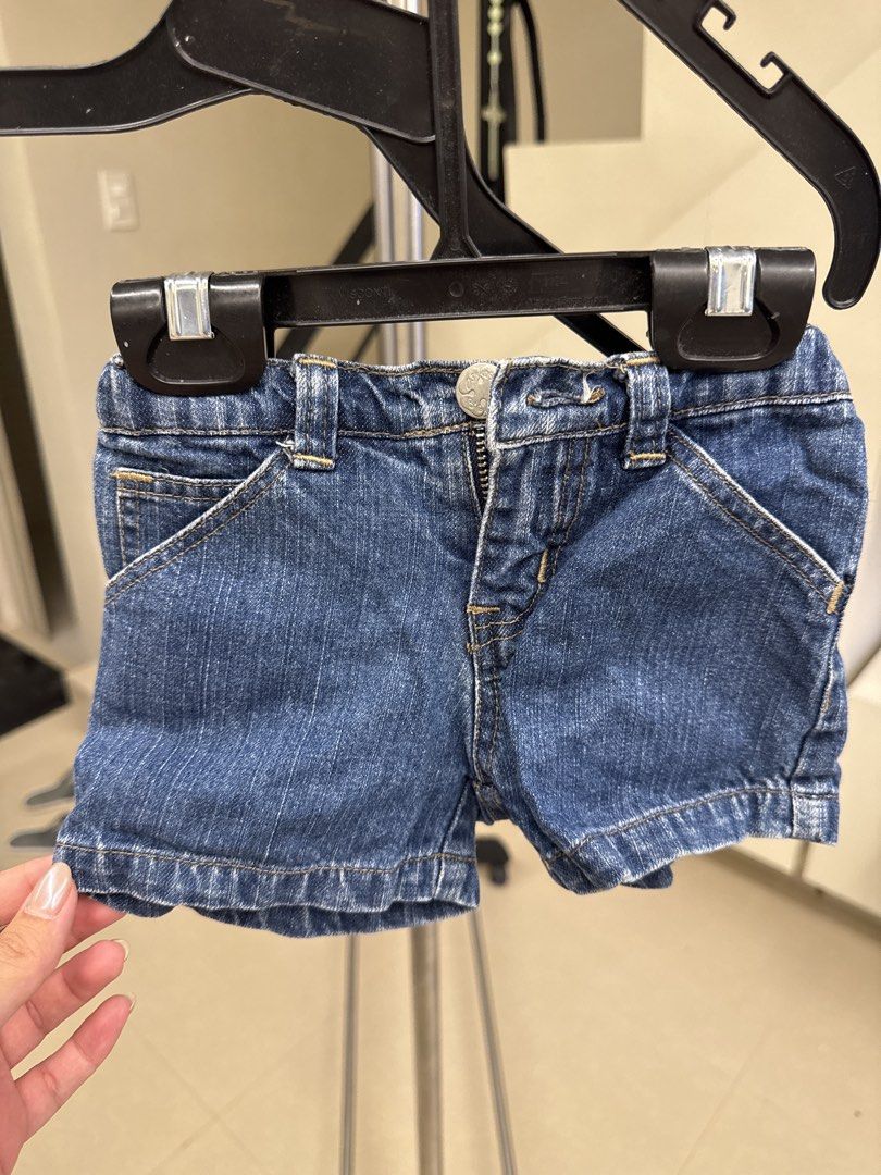OshKosh B'gosh Denim Shorts Size M (Category: Babies & Kids Fashion) located in Manila. Submitted by __nix (Listing ID 1469998225, Image 1). Description: - Brand: OshKosh B'gosh - Color: Blue denim - Size: M (Tag) - Made in: Philippines - Waistband: Elastic at the back for a comfortable fit - Pockets: Front pockets with stylish contrast stitching + cute pink label on the back pocket - Closure: Metal button closure and zipper fly.