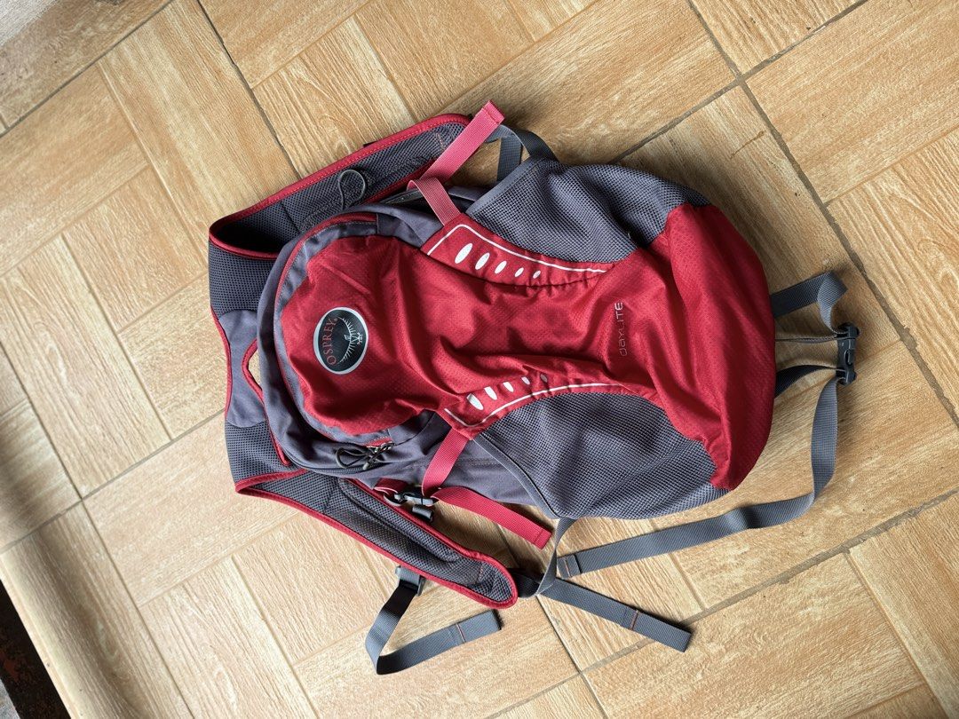 Osprey Daylite Backpack Red Grey (Category: Backpacks) located in Manolo Fortich. Submitted by thrift_by_biji (Listing ID 1470020104, Image 2). Description: - Brand: Osprey Daylite Daypack - Color: Red and Grey - Condition: Clean inside and out, ready for use - Features: Mesh side pockets, breathable shoulder harness - Fit: Adjustable straps with sternum clip - Ideal for: Daily commute or lightweight hiking.