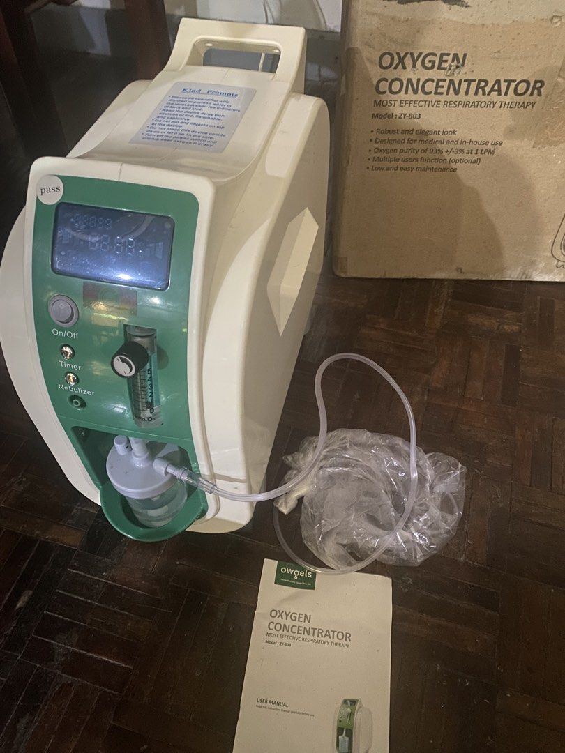 Owgels Oxygen Concentrator Model ZY-803 (Category: Medical Supplies & Tools) located in Marikina City. Submitted by mykjet_fish (Listing ID 1470060595, Image 1). Description: Owgels Oxygen Concentrator (Model ZY-803) with Nebulizer function - Delivers 93% oxygen purity at 1 LPM - Ideal for home care and medical use - Powers on successfully with working blue display panel and controls - Complete set: includes humidifier bottle, nasal tubing, and u