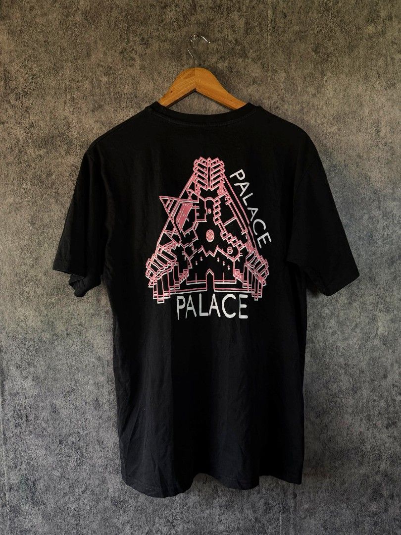 Palace Black Tee Pink Tri-Ferg (Category: Tshirts & Polo Shirts ) located in Quezon City. Submitted by lexthrift (Listing ID 1469988284, Image 2). Description: - Authentic Palace Black T-Shirt - Size: Small - Design: Small pink Tri-Ferg logo on chest, large architectural skeleton graphic on the back - Fit/Style: Crew neck, short sleeves, casual streetwear - Material: Soft cotton fabric - Condition: Inner neck print and wash tag intact.