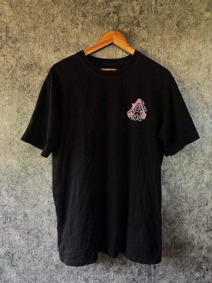 Palace Black Tee Pink Tri-Ferg (Category: Tshirts & Polo Shirts ) located in Quezon City. Submitted by lexthrift (Listing ID 1469988284, Image 1). Description: - Authentic Palace Black T-Shirt - Size: Small - Design: Small pink Tri-Ferg logo on chest, large architectural skeleton graphic on the back - Fit/Style: Crew neck, short sleeves, casual streetwear - Material: Soft cotton fabric - Condition: Inner neck print and wash tag intact.