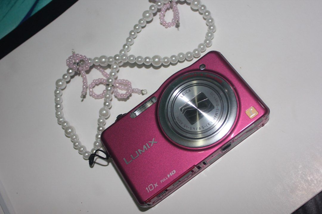 Panasonic Lumix DMC-SZ7 Pink Digital Camera (Category: Cameras) located in Ilagan. Submitted by damnshiela (Listing ID 1470137720, Image 1). Description: -Sample Photos Included at the end - Model: Panasonic Lumix DMC-SZ7 digital camera in a stylish pink finish - Lens: 10x Full HD zoom lens featuring premium Leica optics - Condition: Fully functional, powers on cleanly - Aesthetic: Perfect Y2K vintage digital camera vibe - Portability: Compact si