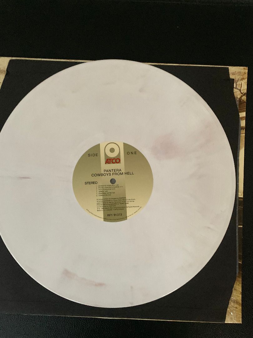 Pantera - Cowboys From Hell (Category: Vinyls) located in Paranaque City. Submitted by bulldogdad (Listing ID 1470140730, Image 3). Description: - Limited Edition White And Whiskey Brown Marbled vinyl. - Released in 1991 under the ATCO label. - One of the greatest and most influential heavy metal albums of all time. - Contains the band's legendary song "Cowboys From Hell". - Played only once. The cover still has its original shrink-wrap, and the 