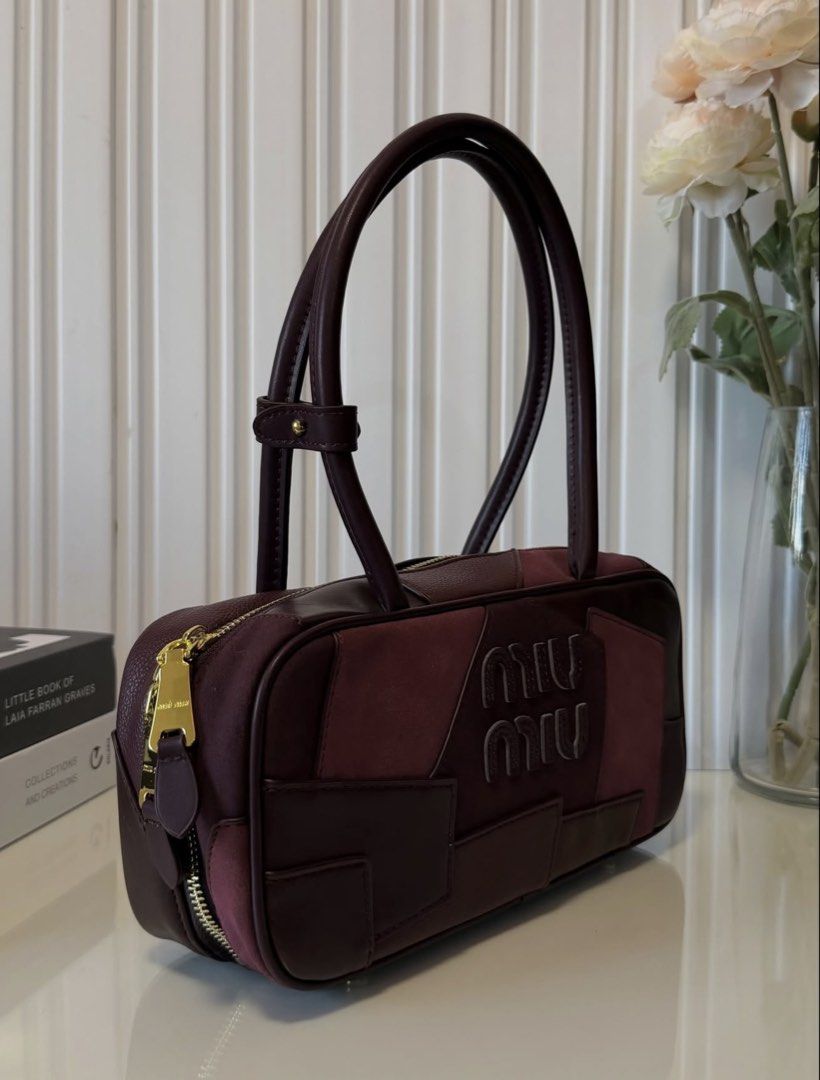 Patchwork Bag (Category: Tote Bags) located in Las Pinas. Submitted by vinccid (Listing ID 1469955519, Image 3). Description: ✨ MIU MIU Patchwork Shoulder Bag – Burgundy ✨ A timeless statement piece in a gorgeous deep burgundy shade, featuring a unique patchwork design with a beautiful combination of leather and suede textures. 🤎 Elegant and sophisticated colorway 🤎 Signature Miu Miu logo detailing 🤎 Gold-tone hardware 🤎 Spacious yet sleek si
