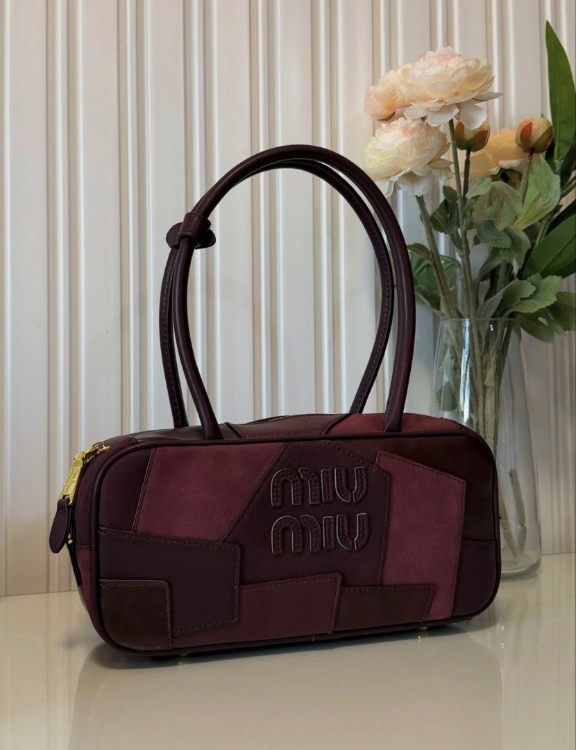 Patchwork Bag (Category: Tote Bags) located in Las Pinas. Submitted by vinccid (Listing ID 1469955519, Image 2). Description: ✨ MIU MIU Patchwork Shoulder Bag – Burgundy ✨ A timeless statement piece in a gorgeous deep burgundy shade, featuring a unique patchwork design with a beautiful combination of leather and suede textures. 🤎 Elegant and sophisticated colorway 🤎 Signature Miu Miu logo detailing 🤎 Gold-tone hardware 🤎 Spacious yet sleek si