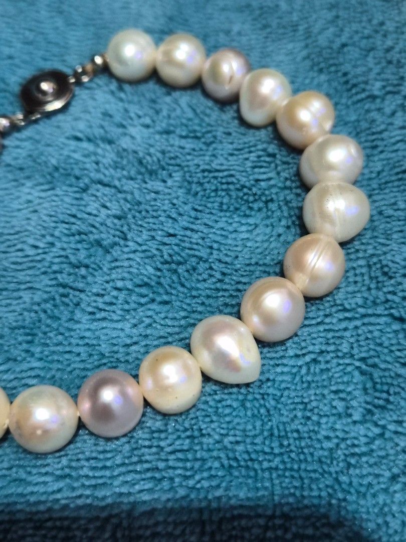 Pearl jewelry Set (Category: Necklaces) located in Mandaue City. Submitted by chuchi152615 (Listing ID 1469971506, Image 2). Description: - Stunning pearl jewelry set in classic white and pinkish tones - Includes 2 elegant beaded bracelets with secure clasps - Features 1 stretch bracelet accented with sparkling rhinestone spacers - Comes with a matching ring centered with a single pearl - Versatile accessories perfect for daily styling or as a th