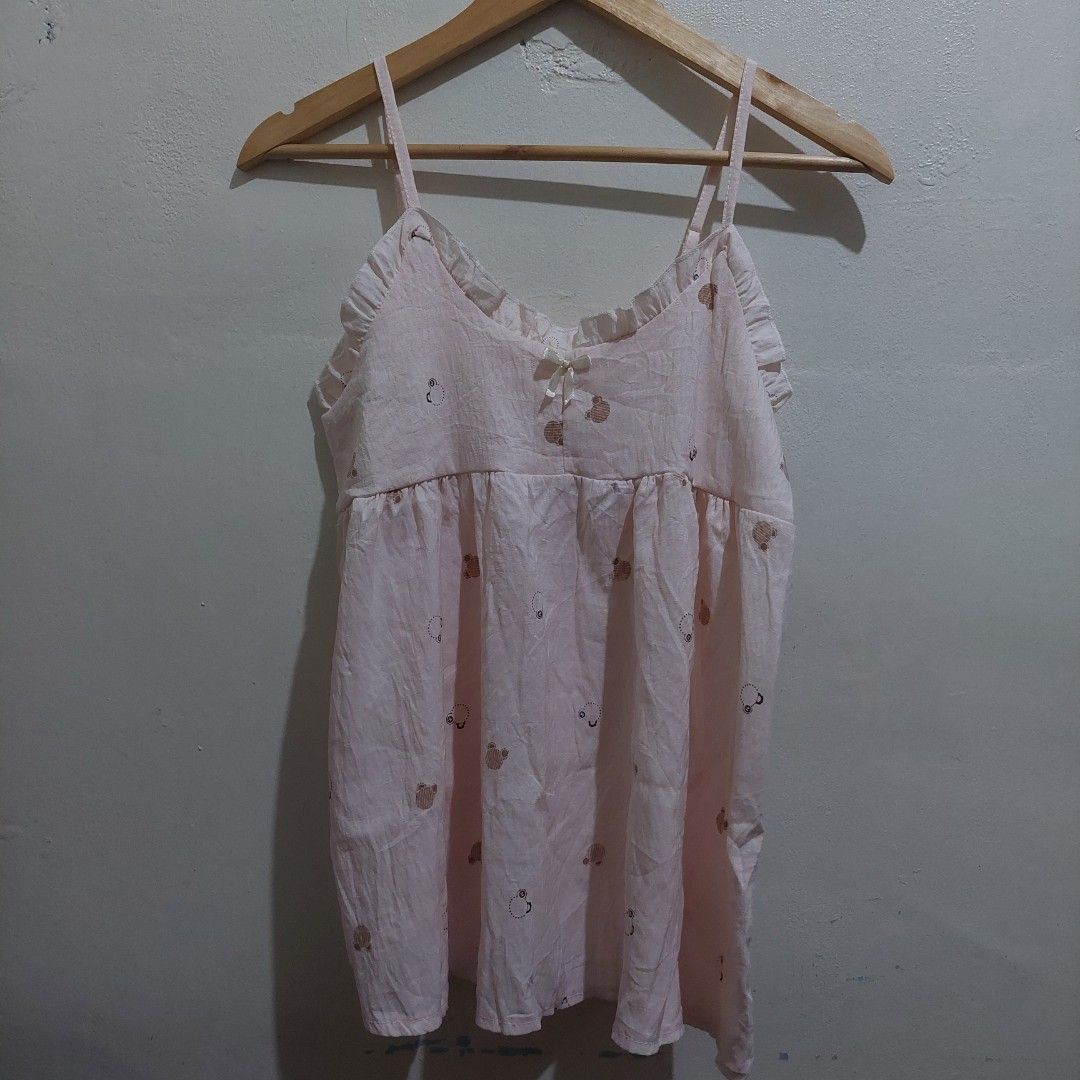 Pink Camisole with Teddy Bear Print and Bow (Category: Sleeveless) located in Governor Generoso. Submitted by cma_rarefitph (Listing ID 1470012000, Image 1). Description: Flatlay Width-16 inches Length-24 (can be adjusted) - Color: Light pink with all-over brown teddy bear print - Features: Adjustable spaghetti straps, cute ruffle trim, and a center white bow - Fit: Pleated design near the top for a flowy, flattering shape - Material: Lightweight