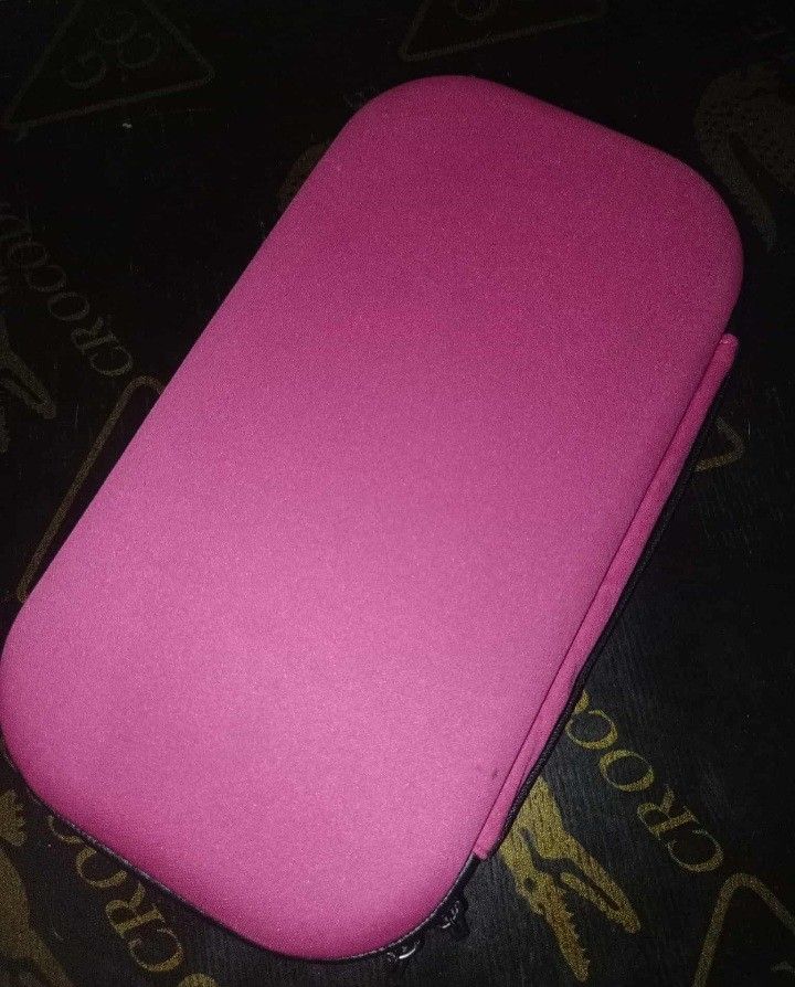 Pink Hard Shell Carrying Case with Molded Interior (Category: Cases & Sleeves) located in Santa Cruz. Submitted by jane.preloved.clothes (Listing ID 1470106918, Image 2). Description: - Color: Bright pink - Type: Hard shell carrying case with smooth zipper closure - Interior: Custom molded foam inserts for secure gadget storage - Storage: Built-in mesh pocket for cables and small items - Condition: Clean interior lining with no rips or stains.