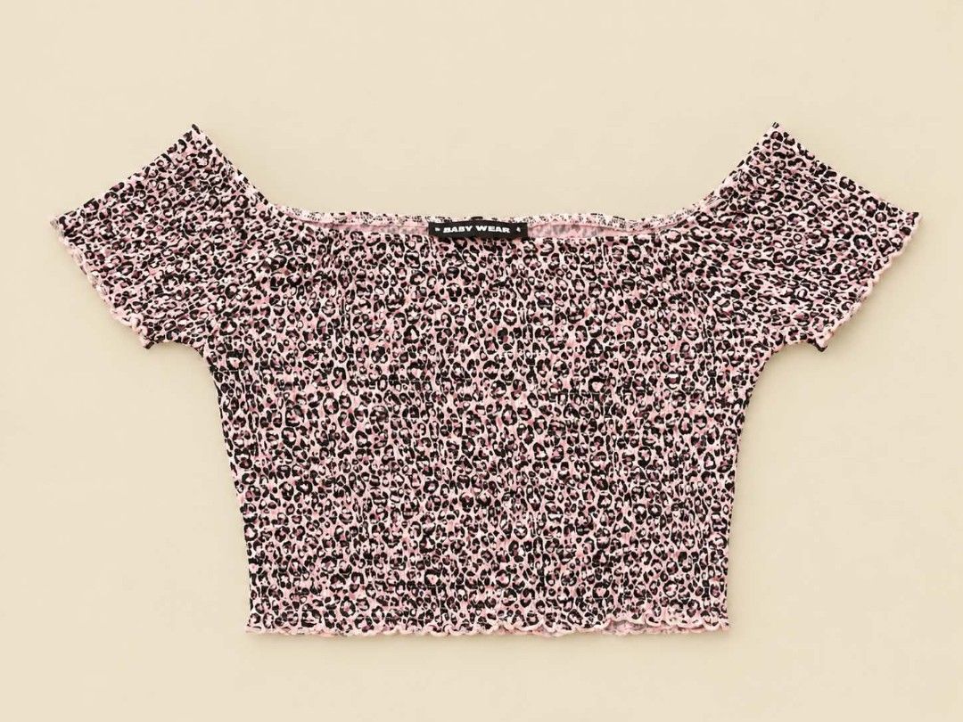 Pink Leopard Print Off-Shoulder Crop Top (Category: Sleeveless) located in Manila. Submitted by joshbelgic17602 (Listing ID 1469970431, Image 1). Description: - Trendy pink and black leopard print design - Off-shoulder neckline with short sleeves - All-over smocked elastic for a stretchy, body-hugging fit - Charming lettuce hem detail on top, sleeves, and hem - Authentic Baby Wear label stitched inside.