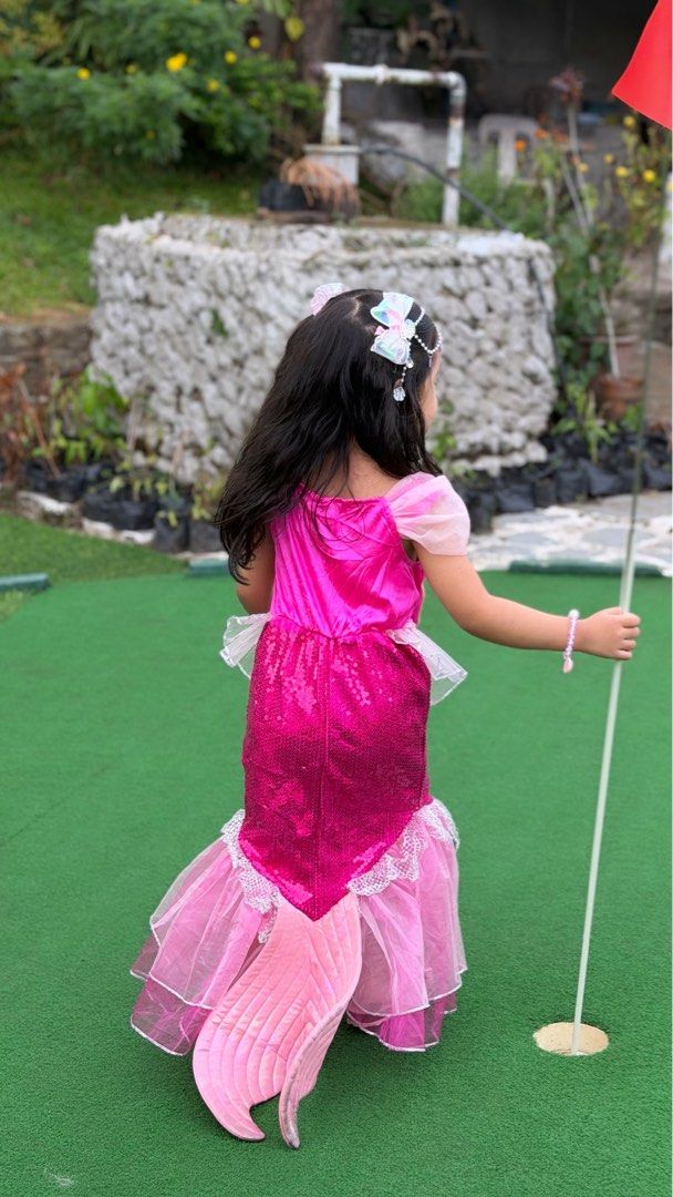 Pink Mermaid Costume (branded) (Category: Babies & Kids Fashion) located in Tagaytay City. Submitted by alexaerina (Listing ID 1470067639, Image 3). Description: - Rare Pink mermaid costume featuring sparkly sequins, shell bodice, sheer tulle layers, and a back fin - 3-4y on tag - Includes a matching pink bucket basket decorated with rhinestones, gems, and ribbon bows - Condition: Worn only once, like new - Ideal for dress-up play, Halloween, or 