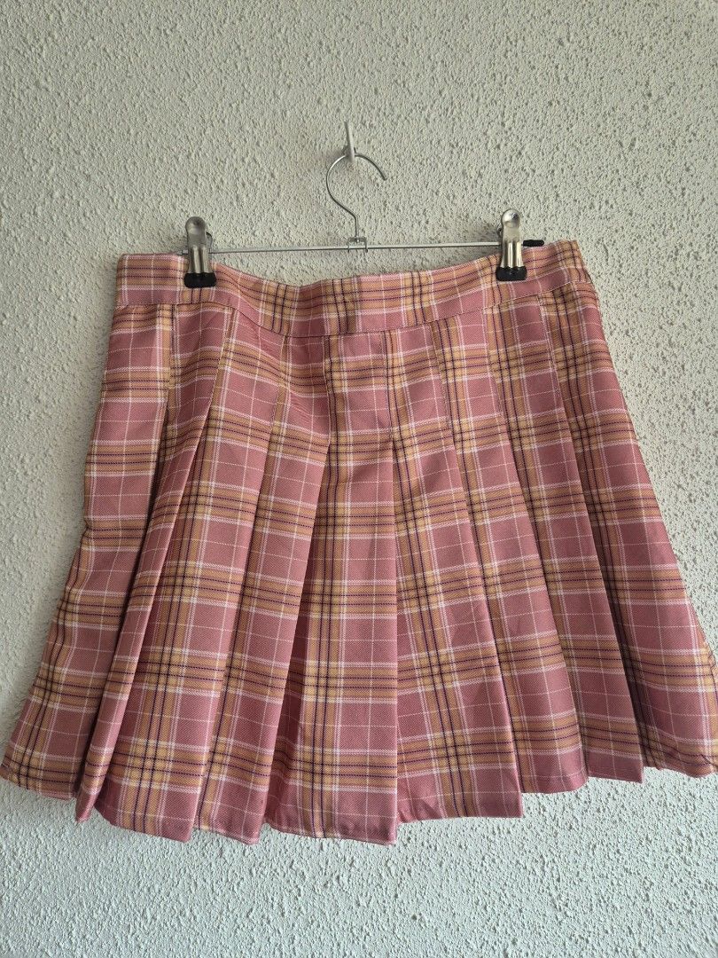 Pink Plaid Pleated Mini skirt (Category: Skirts) located in Manila. Submitted by belovedbyjess (Listing ID 1469972677, Image 1). Description: - Style: Preppy, casual, cute pleated skirt - Pattern & Color: Pink plaid - Fit: High waist with side zipper closure - Comfort: Soft material with built-in white inner lining W18 L 15.
